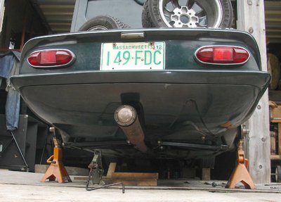 Jackstands under elan rear hubs.JPG and 